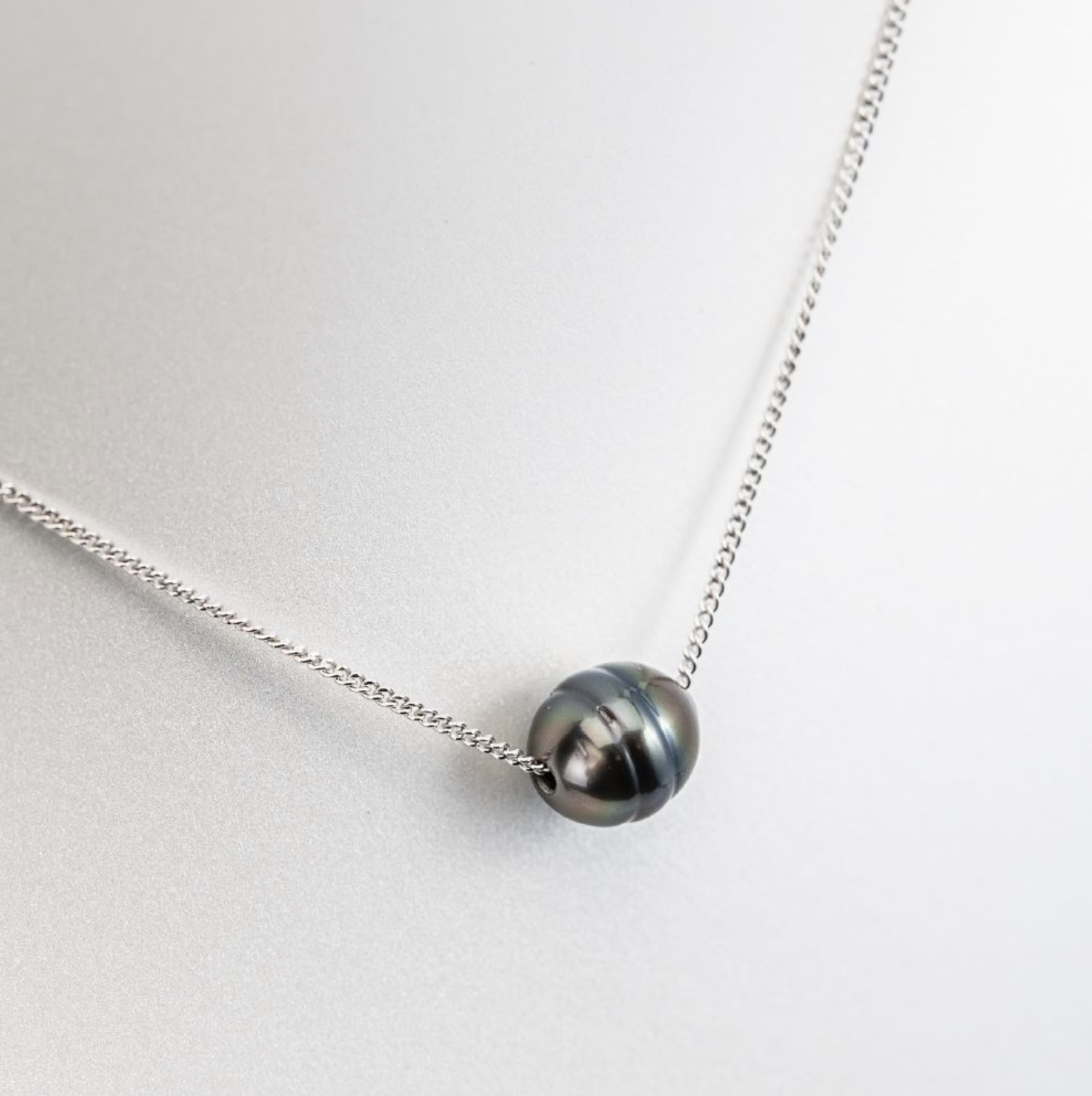 Circled Pearl Pendant on Silver Necklace